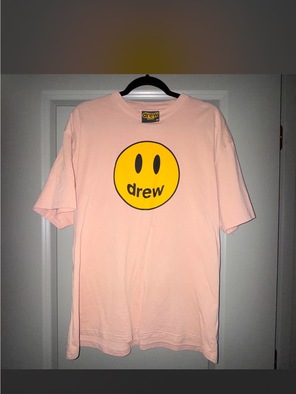 DREW light pink short-sleeve tee with yellow smiley logo